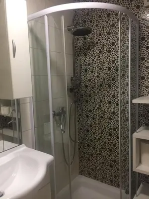a bathroom with a shower and a sink at Apartment Red Square in Ljubljana