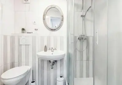 a bathroom with a toilet and a sink and a shower at Blissful Loft Tivoli in Ljubljana