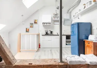 a kitchen with a blue refrigerator in a room at Blissful Loft Tivoli in Ljubljana