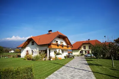 a house with a red roof and a walkway at Apartment Studio Van Bakel Gerard in Bled
