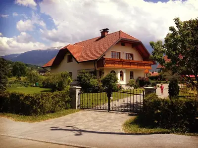 a house with a gate in front of it at Apartment Studio Van Bakel Gerard in Bled