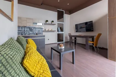 a living room with a couch and a table at Apartma Relax Gaja - In the most beautiful city in the world in Ljubljana