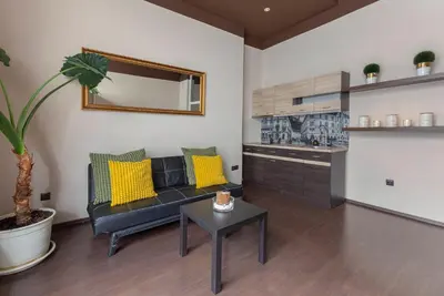 a living room with a couch and a table at Apartma Relax Gaja - In the most beautiful city in the world in Ljubljana