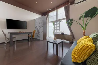 a living room with a couch and a table at Apartma Relax Gaja - In the most beautiful city in the world in Ljubljana