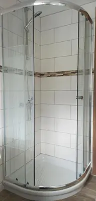 a shower with a glass enclosure in a bathroom at River View Apartments Irena in Bohinj
