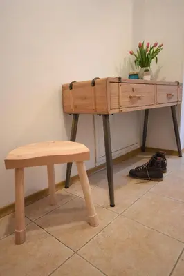 a wooden desk with a bench and a plant at Apartment Bc in Bovec
