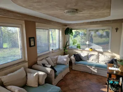 a living room with two couches and two windows at Luxury Apartment Ana with Hot tub in Višnja Gora