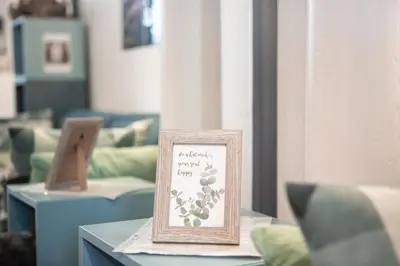a sign sitting on a table in a room at Stylish Apartment with Castle View & Free Parking in Ljubljana