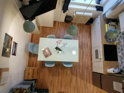 a room with a table and two chairs and balloons at Stylish Apartment with Castle View & Free Parking in Ljubljana