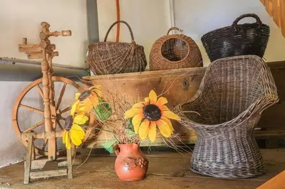 a bunch of baskets and a vase with a flower in it at Apartment Krnicar in Zgornje Gorje