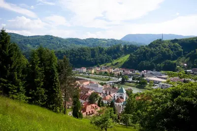 a small town on a hill with a river at Na Kopitarjevi in Laško