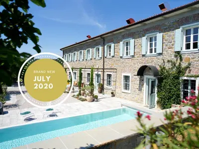 a house with a swimming pool in front of it at Villa Majda in Osp
