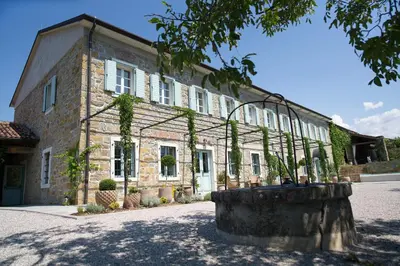 a large brick building with a large window at Villa Majda in Osp