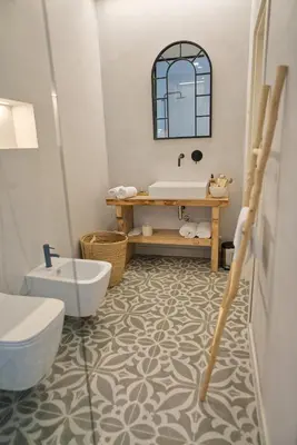 a bathroom with a tub and a toilet and a sink at Villa Majda in Osp