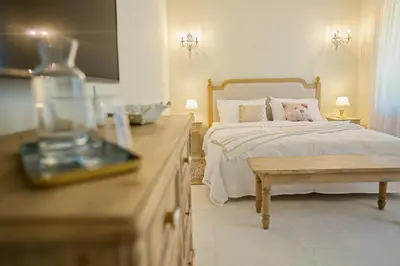 a bedroom with a bed with a table and a counter at Villa Majda in Osp