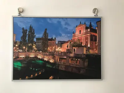 a picture of a bridge over a river at night at Viktor in Ljubljana
