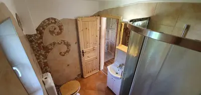 a small bathroom with a toilet and a sink at Tree in Bled