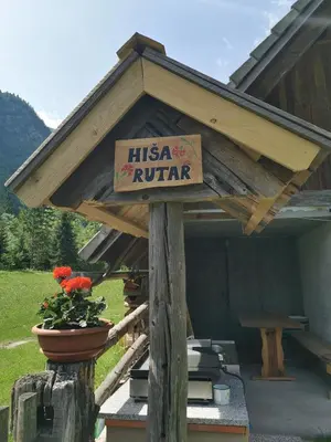 a sign that says hiska rutter on a roof at Hiska Rutar Valley Voje in Studor v Bohinju