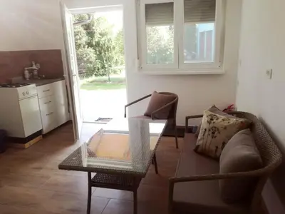 a living room with a couch and a table at Apartment Kokoro in Bogojina