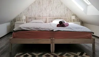 a bedroom with a bed with a teddy bear on it at Apartment Kokoro in Bogojina