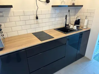a kitchen with a sink and a counter top at Modern studio in the heart of the city in Maribor