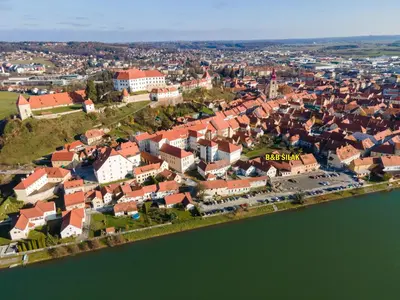 an aerial view of a town next to the water at Bed & Breakfast Šilak in Ptuj