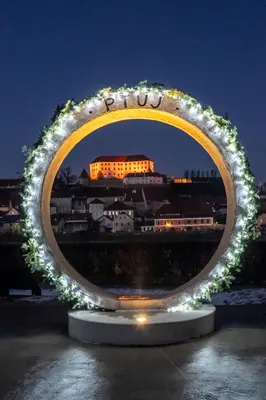 a large circle of lights with a building in the background at Bed & Breakfast Šilak in Ptuj