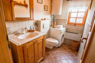 a bathroom with a sink and a toilet at Vila Idila in Lendava