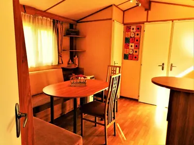 a small dining room with a table and chairs at Holiday home Rozika in Slovenj Gradec