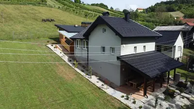 an aerial view of a house with solar panels on it at Vila Tamaškut in Lendava