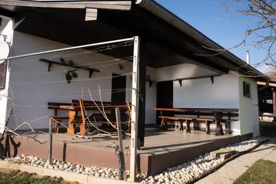 a screened in porch with a picnic table on it at Zidanica Balantič in Dobrovnik