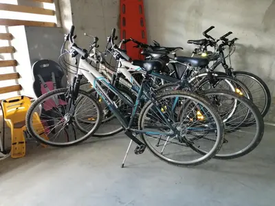 a group of bikes parked in a garage at Apartments Maleric with Indoor Pool and Wellness in Dragatuš