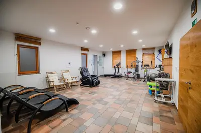 a gym with several exercise equipment in a room at Apartments Maleric with Indoor Pool and Wellness in Dragatuš