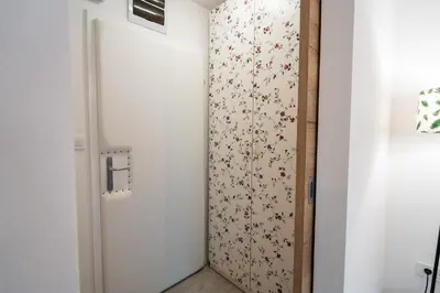 a door in a room with a wall at Apartment Loyd, Kranjska Gora - studio in Kranjska Gora