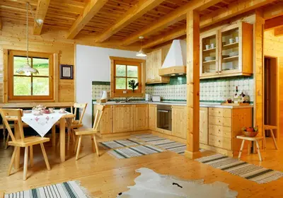 a kitchen with a table and a dining room at Farm Stay Pirc in Laško