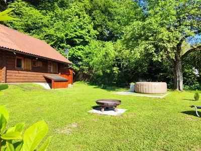 a park with a picnic table in the grass at Silent Orchard in Naklo