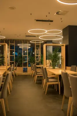 a dining room with a table and chairs at Hotel Aqua Roma in Rimske Toplice