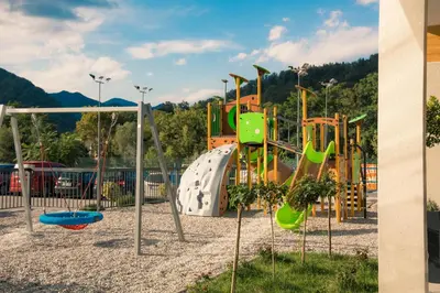 a park with a playground with a slide at Hotel Aqua Roma in Rimske Toplice