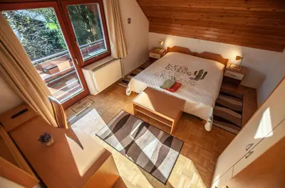 an overhead view of a bedroom with a bed and a window at Guest House Alenka in Bohinj