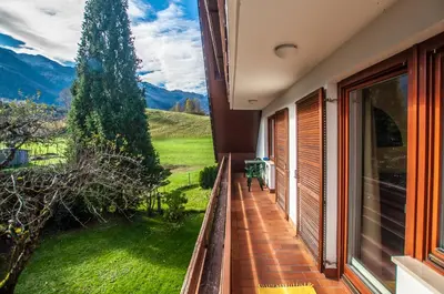 a balcony of a house with a view of the mountains at Guest House Alenka in Bohinj