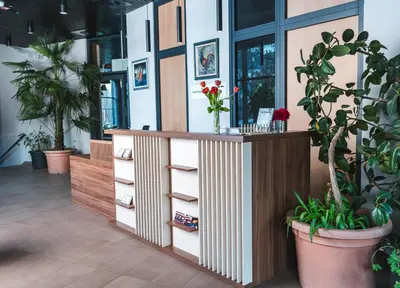 an office with plants and a desk with drawers at Bed and Breakfast Portal in Ljubljana