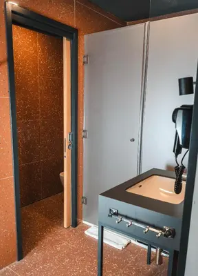 a bathroom with a sink and a toilet at Bed and Breakfast Portal in Ljubljana