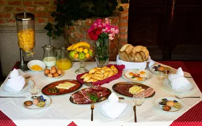 a table with many different types of food on it at Bed and Breakfast Portal in Ljubljana