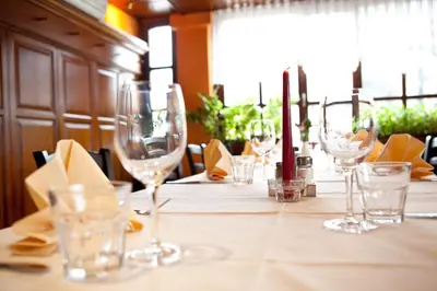 a table with wine glasses on top of it at Bed and Breakfast Portal in Ljubljana