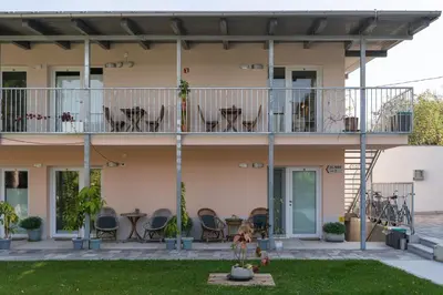 a house with chairs and tables on the balcony at Accommodation Baron in Ljubljana