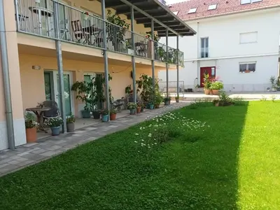 a courtyard of an apartment building with plants at Accommodation Baron in Ljubljana
