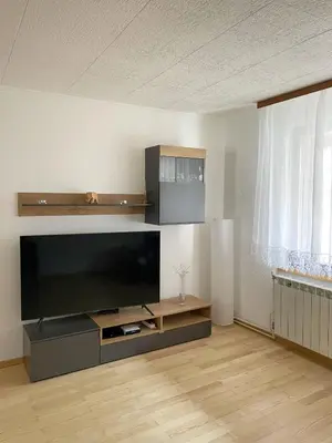a living room with a large flat screen tv at Apartma Bubi in Bovec