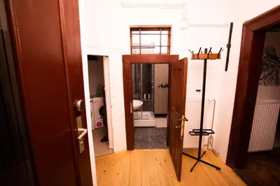 a room with a bathroom with a sink and a mirror at Dežnik in Ljubljana