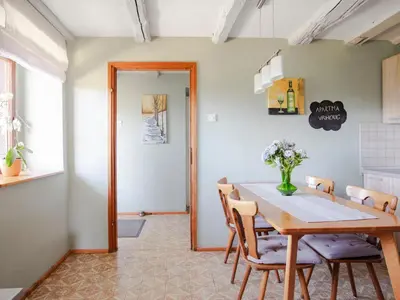 a dining room with a table and chairs at Apartment Vrhouc in Tolmin