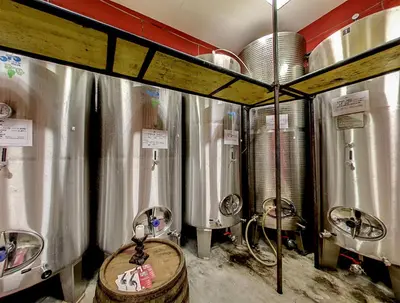 a bunch of silver tanks in a room at ČEBRON FAMILY ESTATE in Branik